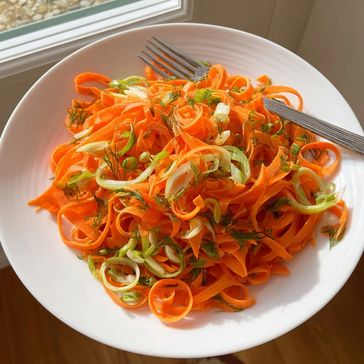 Crisp Marinated Lemon Dill Carrot Salad glistening with bright citrus dressing in a serving bowl