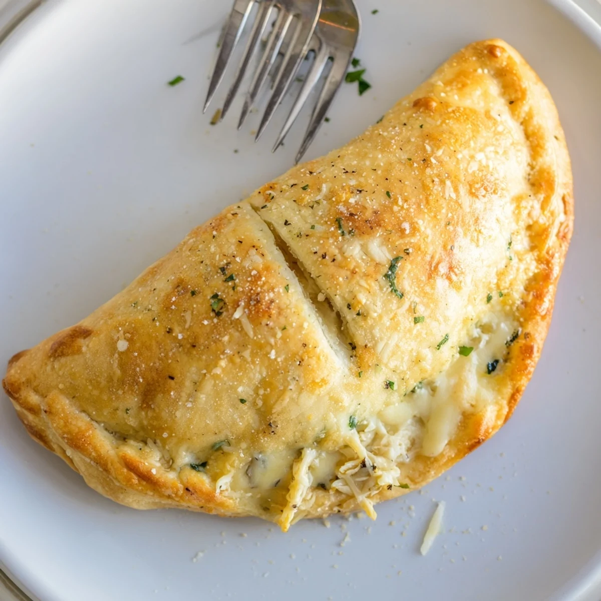 Crispy Cheesy Chicken Alfredo Air Fryer Calzones with golden crust, gooey filling