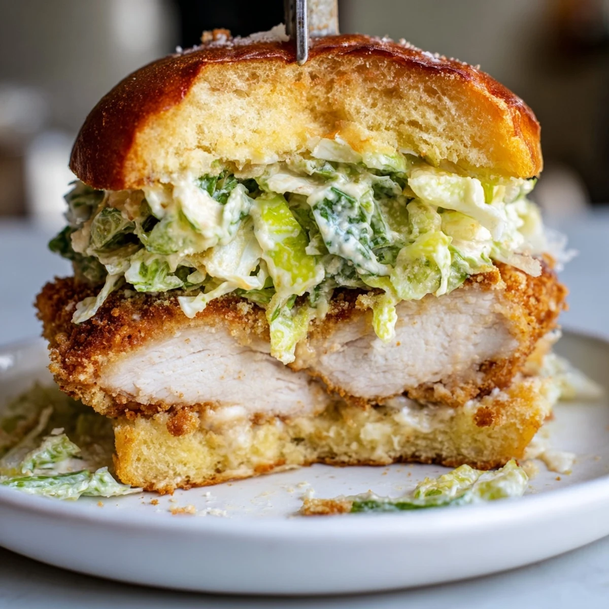 Crispy Chicken Caesar Sandwich Recipe layered with panko-crusted chicken, tangy creamy dressing