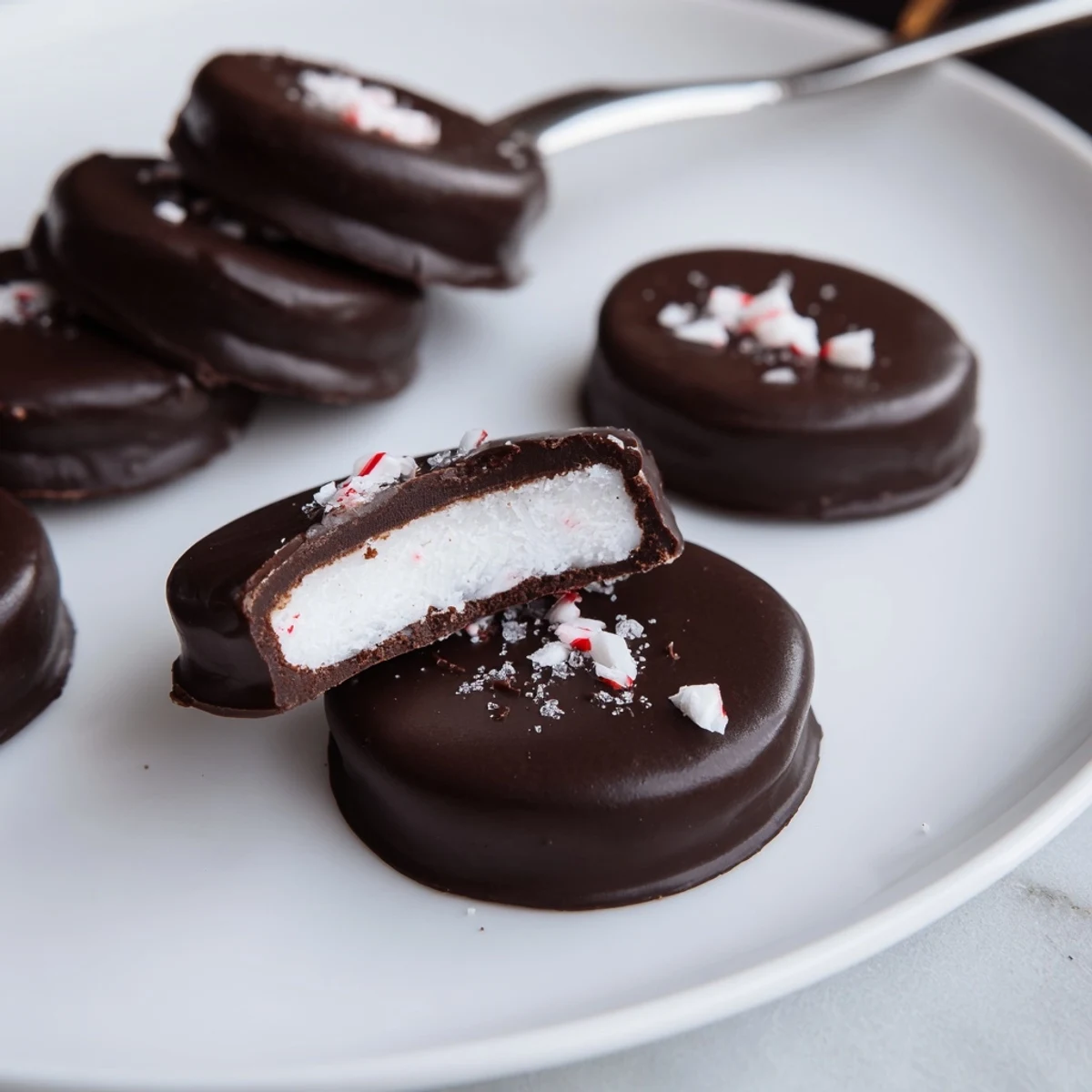 Round Peppermint Patties with smooth dark coating and creamy mint filling