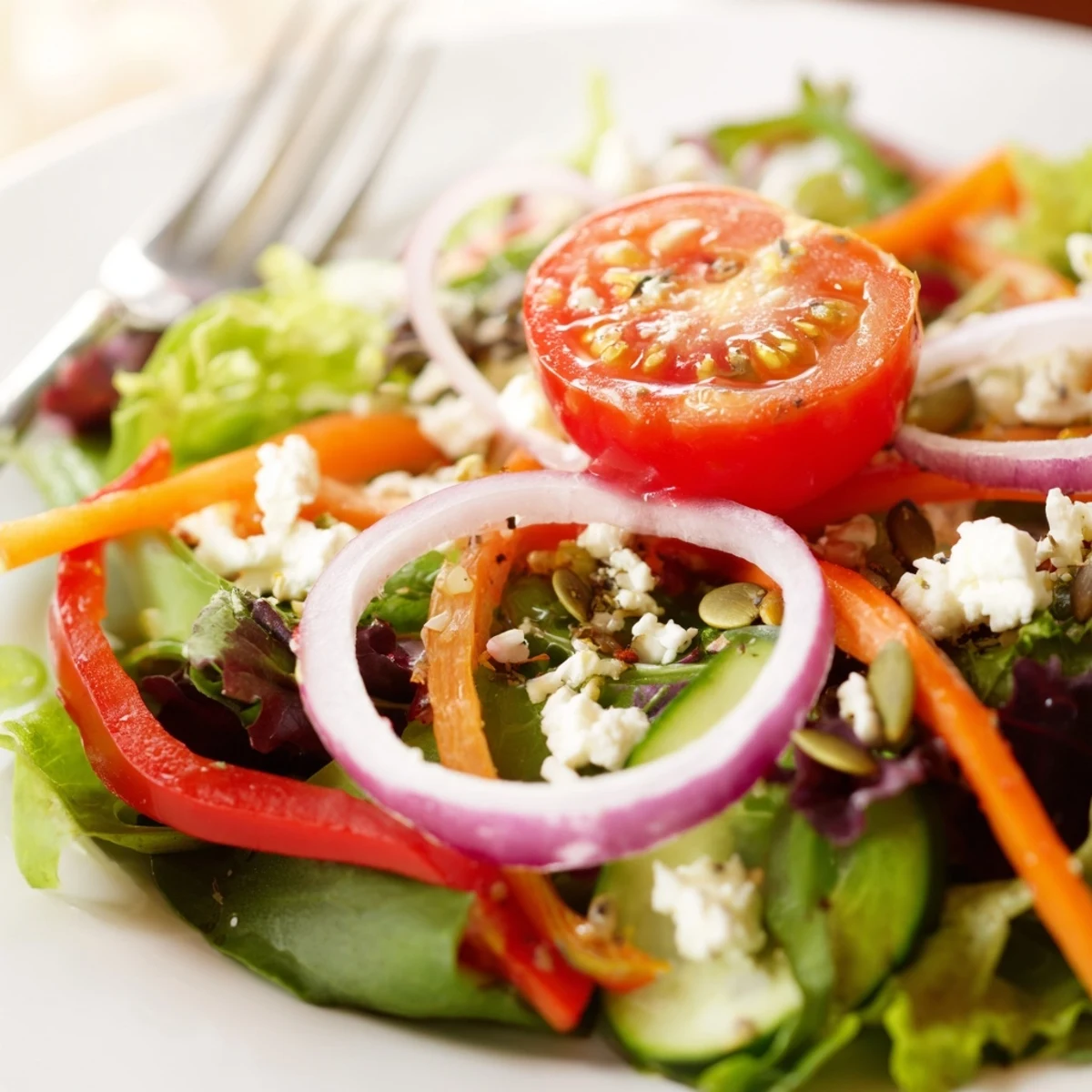 Garden Salad with crisp romaine, juicy tomatoes, and tangy vinaigrette drizzle.