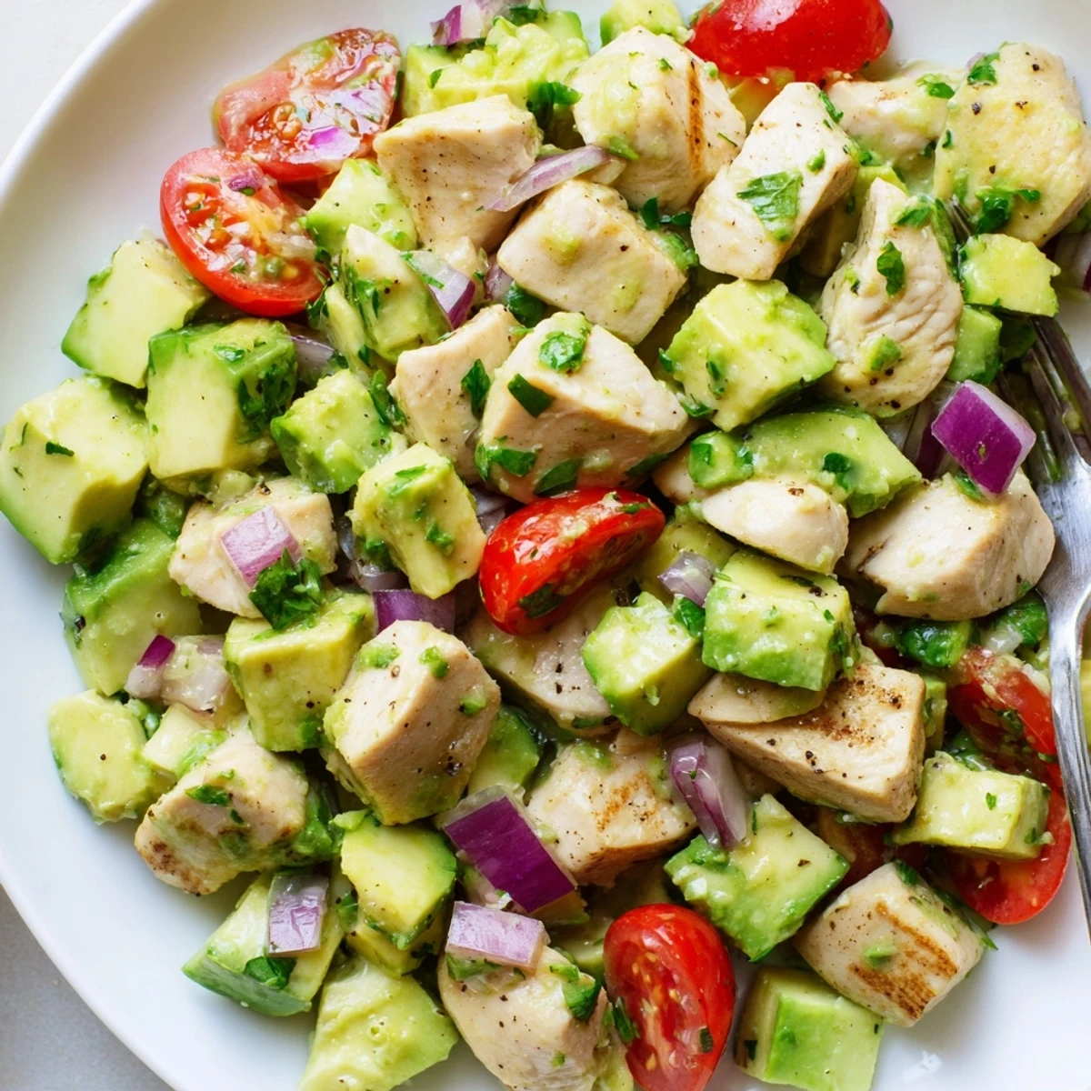 Healthy Avocado Chicken Salad with juicy grilled chicken, creamy avocado, lime dressing